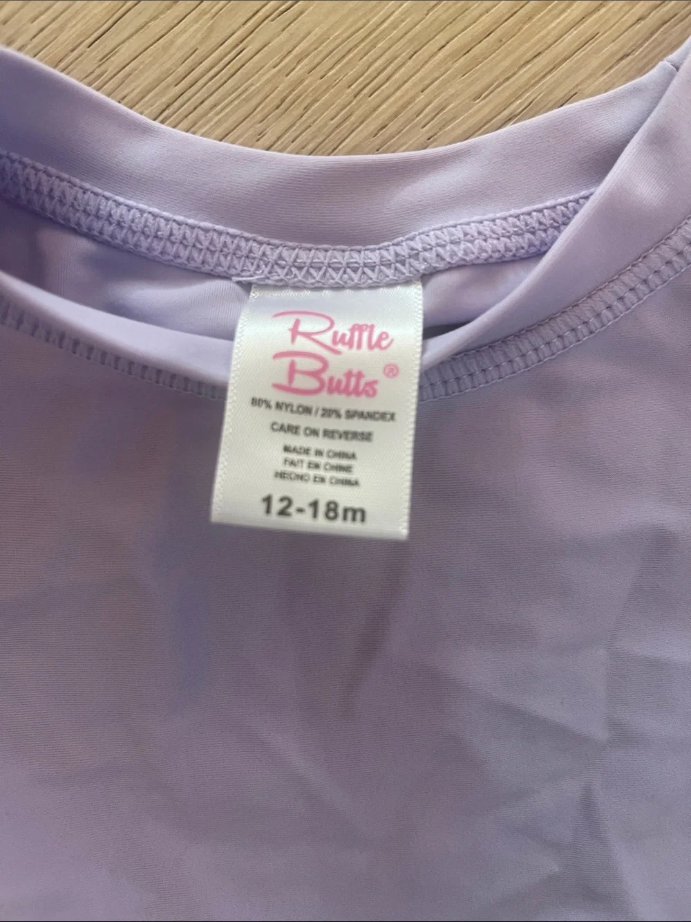 Ruffle Butts Lilac Long-Sleeve Peplum Rash Guard with Striped Bottoms